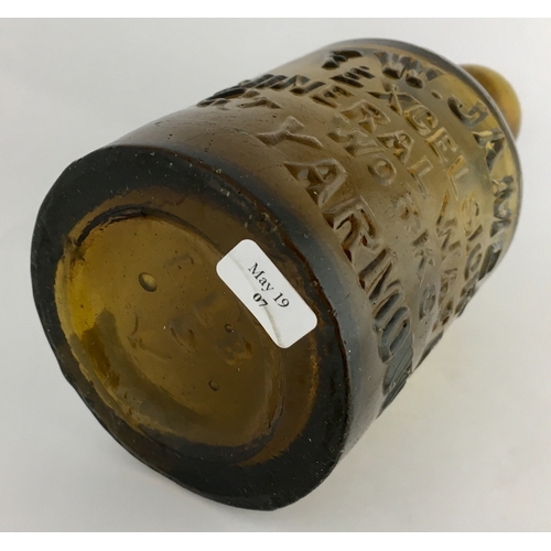 647 - GT YARMOUTH SELTZER BOTTLE. 6.25ins tall. Dark amber glass, heavily embossed F.W. JAMES / EXCELSIOR/... 