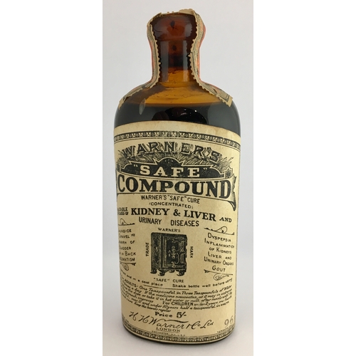 653 - LABELLED WARNERS SAFE COMPOUND. 6ins tall. Amber glass, round shouldered with fully intact, original... 