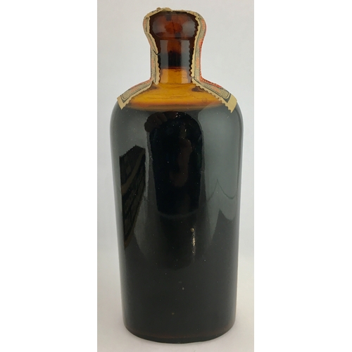 653 - LABELLED WARNERS SAFE COMPOUND. 6ins tall. Amber glass, round shouldered with fully intact, original... 