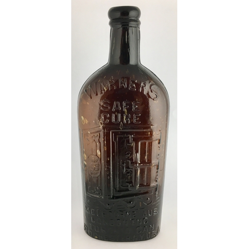 655 - WARNERS FOUR CITIES SAFE CURE BOTTLE. 9.25ins tall. One pint, deep amber glass, sloping shoulders, l... 