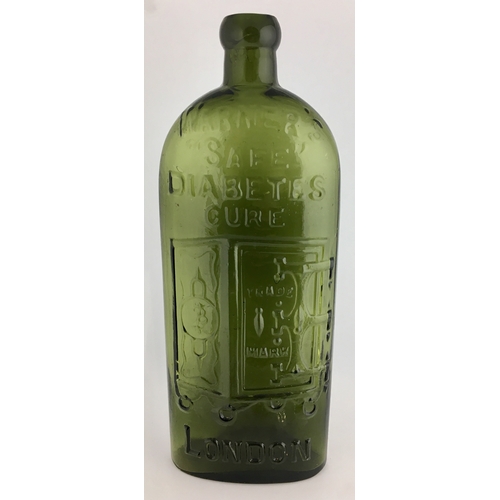 656 - WARNERS SAFE DIABETES CURE BOTTLE. 9.5ins tall. One pint, green glass, sloping shoulders, short neck... 