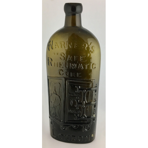 658 - WARNERS SAFE RHEUMATIC CURE BOTTLE. 9.5ins tall. One pint, olive amber glass, sloping shoulders, sho... 