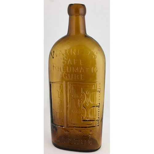 659 - WARNERS SAFE RHEUMATIC CURE BOTTLE. 9.5ins tall. One pint, bright amber glass, sloping shoulders, lo... 