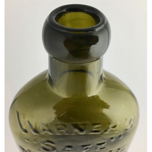 662 - WARNERS SAFE NERVINE BOTTLE. 7.25ins tall. Half pint, olive green glass, sloping shoulders, long nec... 