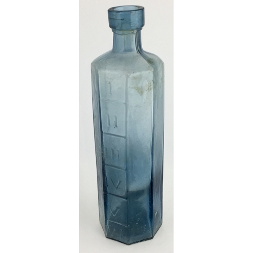 667 - OCTAGONAL PHARMACY MEASURE BOTTLE. 6.75ins tall. octagonal shape, pale blue glass, embossed with Rom... 