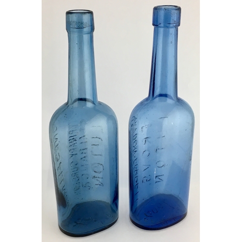 669 - LUTON VETERINARY BOTTLES DUO. 8.25ins tall. Blue glass, rounded shoulders, long necks, one JONES & E... 