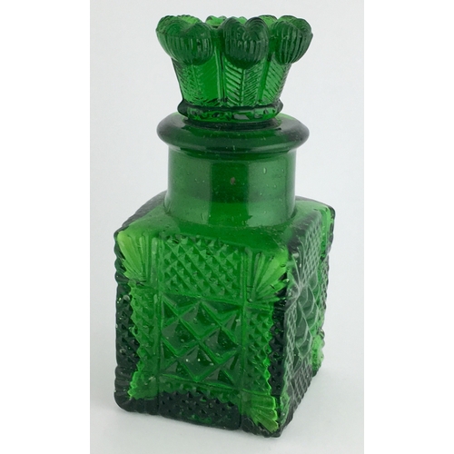 671 - SMELLING SALTS BOTTLE. 4ins tall. Bright green glass, multi facetted cut glass, square body, with im... 