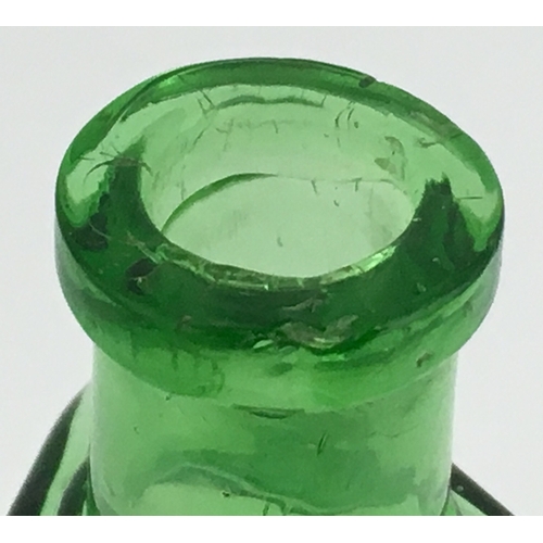 685 - WILSONS PATENT POISON BOTTLE. (DP pg 59) 4.5ins tall. Triangular shape, green glass with scalloped e... 