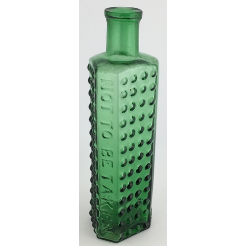 696 - TAYLOR’S PATENT POISON BOTTLE. (DP pg 55) 6.25ins tall. 6oz green glass, one half is semi circular, ... 