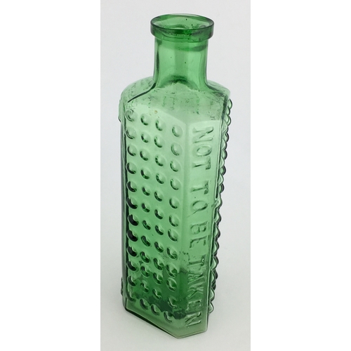 697 - TAYLOR’S PATENT POISON BOTTLE. (DP pg 55) 5.25ins tall. 4oz green glass, one half is semi circular, ... 