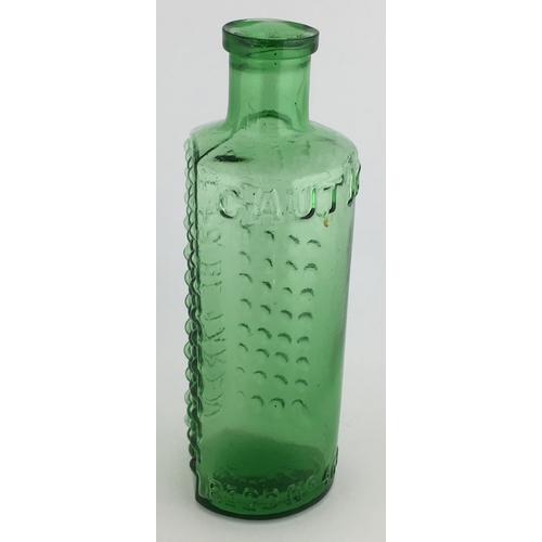 697 - TAYLOR’S PATENT POISON BOTTLE. (DP pg 55) 5.25ins tall. 4oz green glass, one half is semi circular, ... 