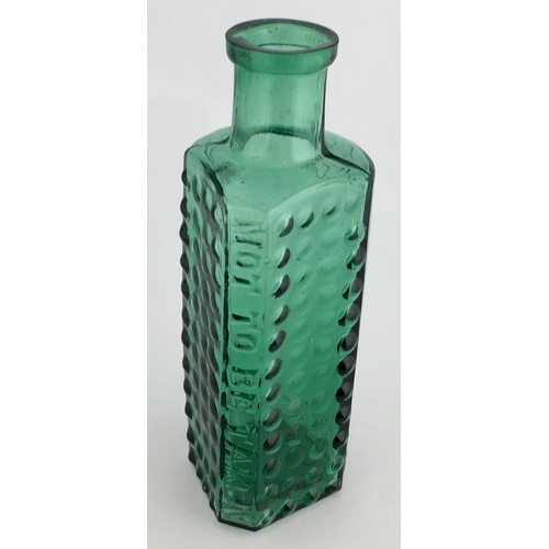 698 - TAYLOR’S PATENT POISON BOTTLE. (DP pg 55) 4.25ins tall. 2oz turquoisey green glass, one half is semi... 