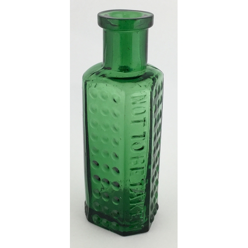 699 - TAYLOR’S PATENT POISON BOTTLE. (DP pg 55) 3.25ins tall. 1oz green glass, one half is semi circular, ... 