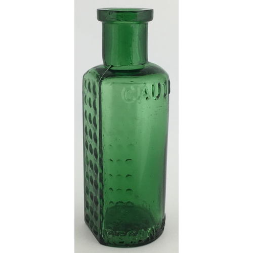 699 - TAYLOR’S PATENT POISON BOTTLE. (DP pg 55) 3.25ins tall. 1oz green glass, one half is semi circular, ... 