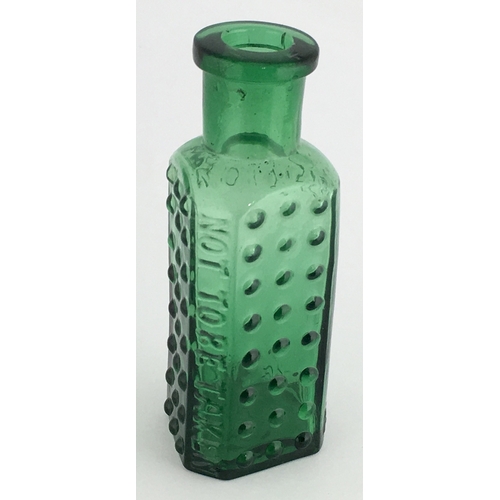 700 - TAYLOR’S PATENT POISON BOTTLE. (DP pg 55) 2.5ins tall. 1/2oz green glass, one half is semi circular,... 