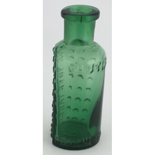 700 - TAYLOR’S PATENT POISON BOTTLE. (DP pg 55) 2.5ins tall. 1/2oz green glass, one half is semi circular,... 