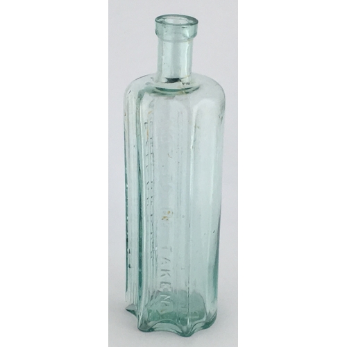 701 - VERTEBRAE POISON BOTTLE. (DP pg 56) 7.25ins tall. Aqua glass, circular section with two vertical nar... 