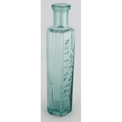 702 - TAYLOR’S STYLE POISON BOTTLE. 5.25ins tall. Aqua glass, one half is semi circular, other with 3 pane... 