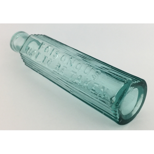 702 - TAYLOR’S STYLE POISON BOTTLE. 5.25ins tall. Aqua glass, one half is semi circular, other with 3 pane... 