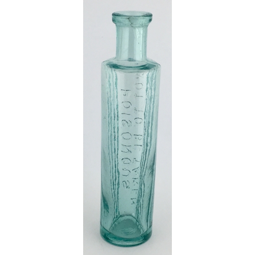 702 - TAYLOR’S STYLE POISON BOTTLE. 5.25ins tall. Aqua glass, one half is semi circular, other with 3 pane... 