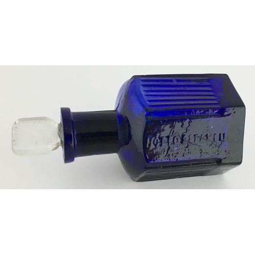 703 - HEXAGONAL POISON BOTTLE. 3.25ins tall to top of clear glass stopper (sealed in). Cobalt blue glass, ... 