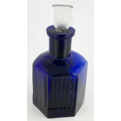 703 - HEXAGONAL POISON BOTTLE. 3.25ins tall to top of clear glass stopper (sealed in). Cobalt blue glass, ... 