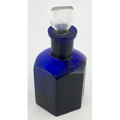 703 - HEXAGONAL POISON BOTTLE. 3.25ins tall to top of clear glass stopper (sealed in). Cobalt blue glass, ... 