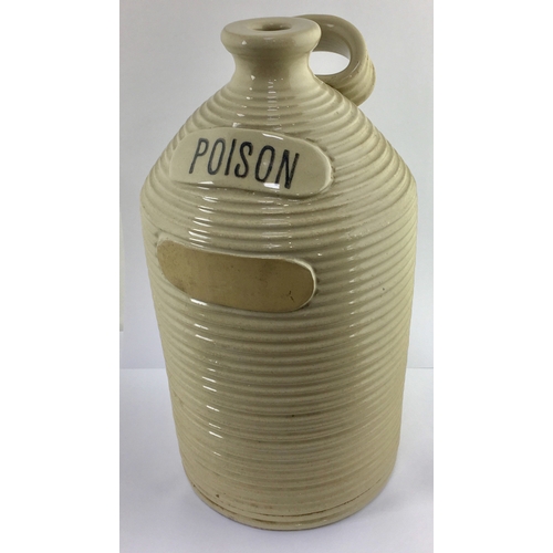 705 - POISON FLAGON. 13ins tall. Straight sided flagon with deep horizontal ribbing, off white glaze, rear... 