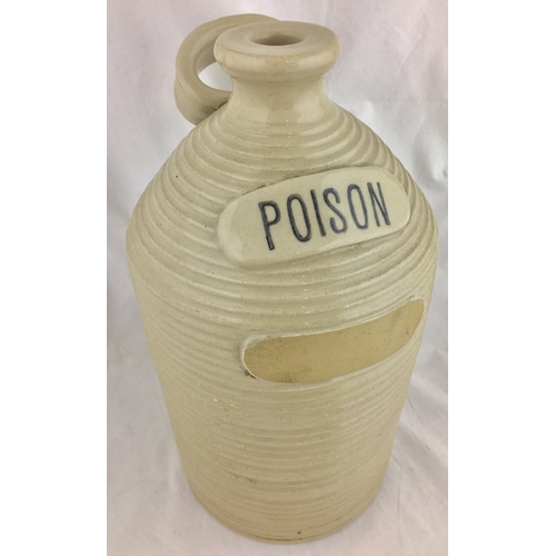 705 - POISON FLAGON. 13ins tall. Straight sided flagon with deep horizontal ribbing, off white glaze, rear... 