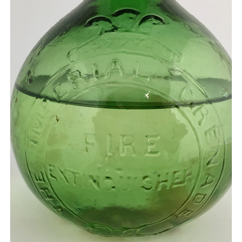 613 - IMPERIAL FIRE GRENADES IN RACK. Trio of bright green glass spherical bodied grenades, each 6.5ins ta... 