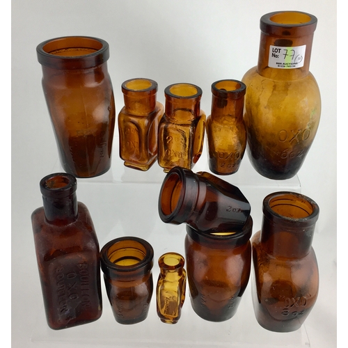 77 - OXO JARS GROUP. Tallest 5.5.ins, amber glass, variety of designs/ sizes, most embossed. Some need a ... 