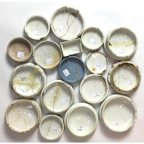 167 - POT LID GROUP. A variety of multicoloured, black & white lids, all damaged. (17)