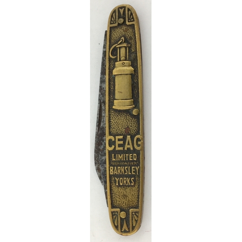 19 - BARNSLEY CEAG PENKNIFE. 3.25ins long. Brass construction, embossed with miners lamp each side. Very ... 