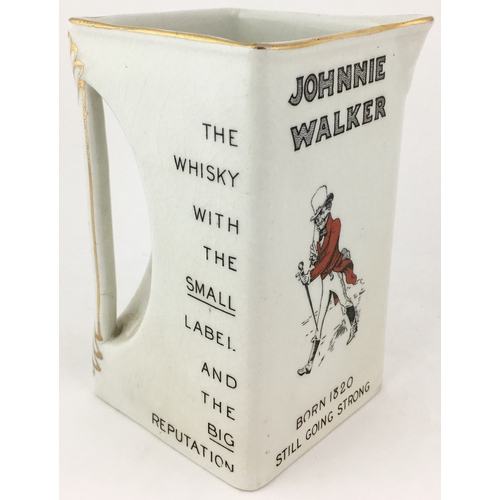 29 - JOHNNIE WALKER WATER JUG. 6ins tall. Square shaped jug with familiar striding Johnnie Walker image t... 