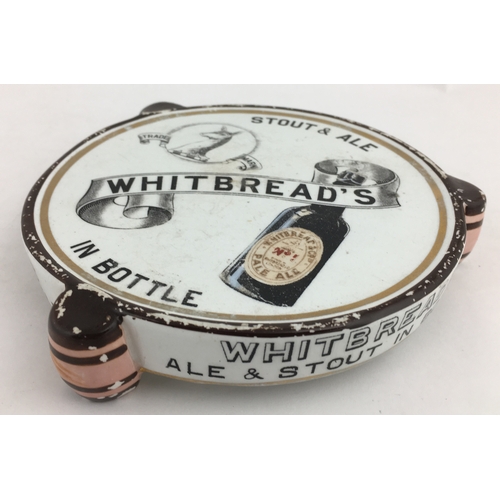 56 - WHITBREAD COASTER. 6ins diam at widest point. Ceramic coaster, 3 barrels forming feet, pict. images ... 