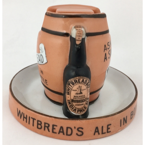 57 - WHITBREAD MATCHBOX HOLDER/ ASHTRAY. 3.6ins tall. Barrel shape with supporting beer bottles each side... 