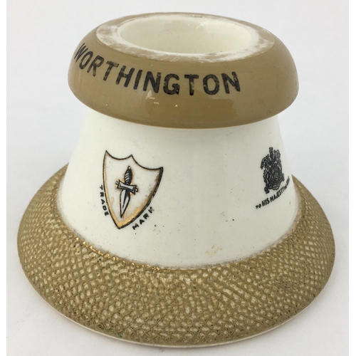 62 - WORTHINGTON MATCHHOLDER/ STRIKER. 2.75ins tall. Capstan shape - coat of arms & pict. t.m. each side,... 