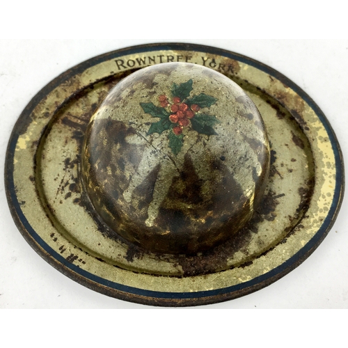 104 - ROWNTREES CHRISTMAS PUDDING TIN. 3.2ins diam oval base. Minor overall general wear. (7.5/10)