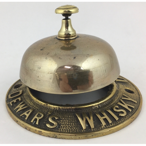 116 - DEWARS BRASS COUNTER BELL. 4.4ins diam. Raised lettering, bell working, 2 holes to permit screwing f... 