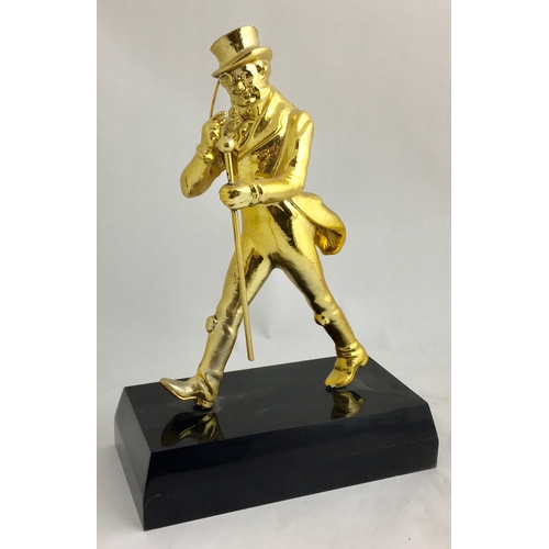 124 - JOHNNIE WALKER BACK BAR STATUETTE. 11.5ins tall. Extremely heavy cast gold coloured figure on black ... 