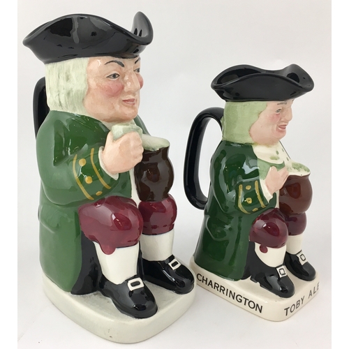 172 - CHARRINGTON TOBY ALE TOBY JUG plus ANOTHER. Tallest 9ins. Multi-coloured seated gents holding glass ... 