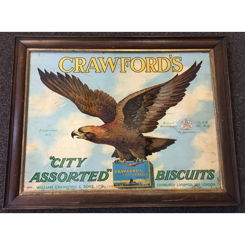 214 - CRAWFORDS FRAMED SHOWCARD. 32 by 25ins. Multicoloured showcard, pict. of spread winged eagle with pa... 