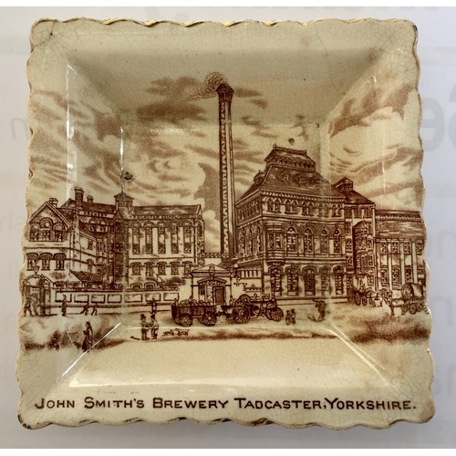 230 - JOHN SMITH’S BREWERY JUG & ASHTRAY. Jug 6ins tall. Off white ceramic - highly detailed scene of the ... 