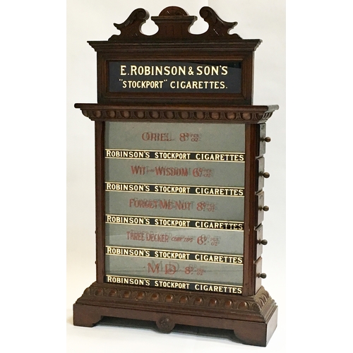 243 - E. ROBINSON & SONS “STOCKPORT” CIGARETTES CABINET. 34.25 by 21.5ins. Highly ornate wooden display ci... 