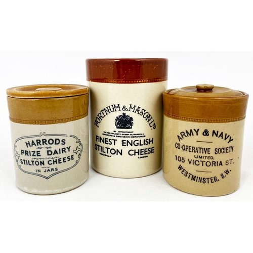 13 - CHEESE JAR TRIO. Tallest 5.5ins, Fortnum & Mason, Harrods plus Army & Navy, 2 lidded. P. m to rear. ... 