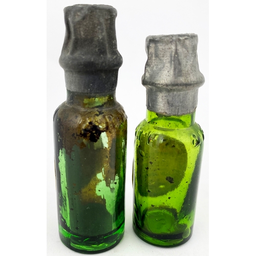 202 - MINIATURE LABELLED LEATH BOTTLES DUO. Tallest 2.5ins, green glass, paper label. Original sealed tops... 