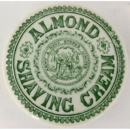 479 - ARMY & NAVY ALMOND SHAVING CREAM POT LID. 3.25ins diam. Strong mid green transfer, pict. to centre. ... 