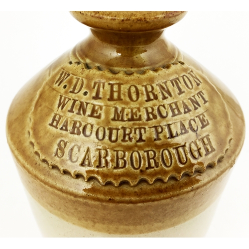 487 - SCARBOROUGH SLAB SEAL FLAGON. T.t, rear handle, chunky slab across shoulder ‘W D THORNTON/ WINE MERC... 