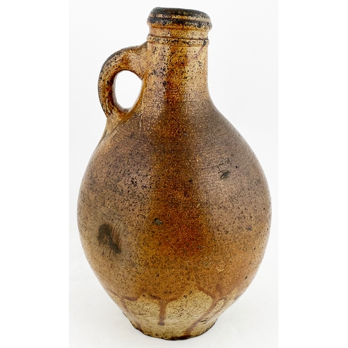 495 - BELLARMINE TYPE FLAGON. 10.5ins tall, variating salt glaze, wonky neck, small rear handle. Delightfu... 