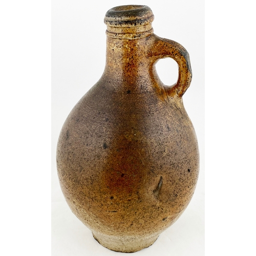 495 - BELLARMINE TYPE FLAGON. 10.5ins tall, variating salt glaze, wonky neck, small rear handle. Delightfu... 